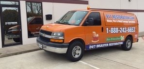 Water Damage Restoration Van At Job Site